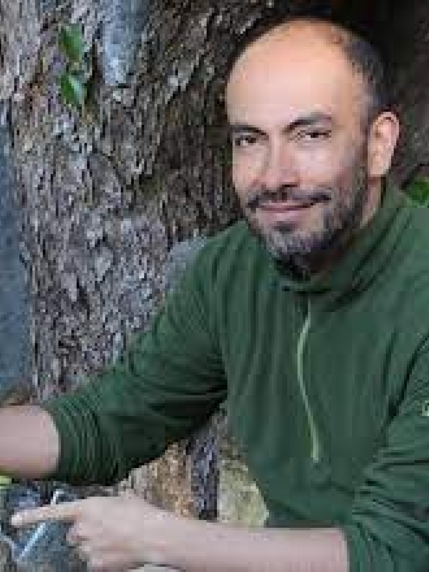 Carlos E.  Guarnizo