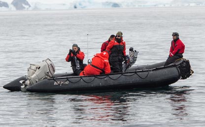 Researchers in a boat at the Antarctic